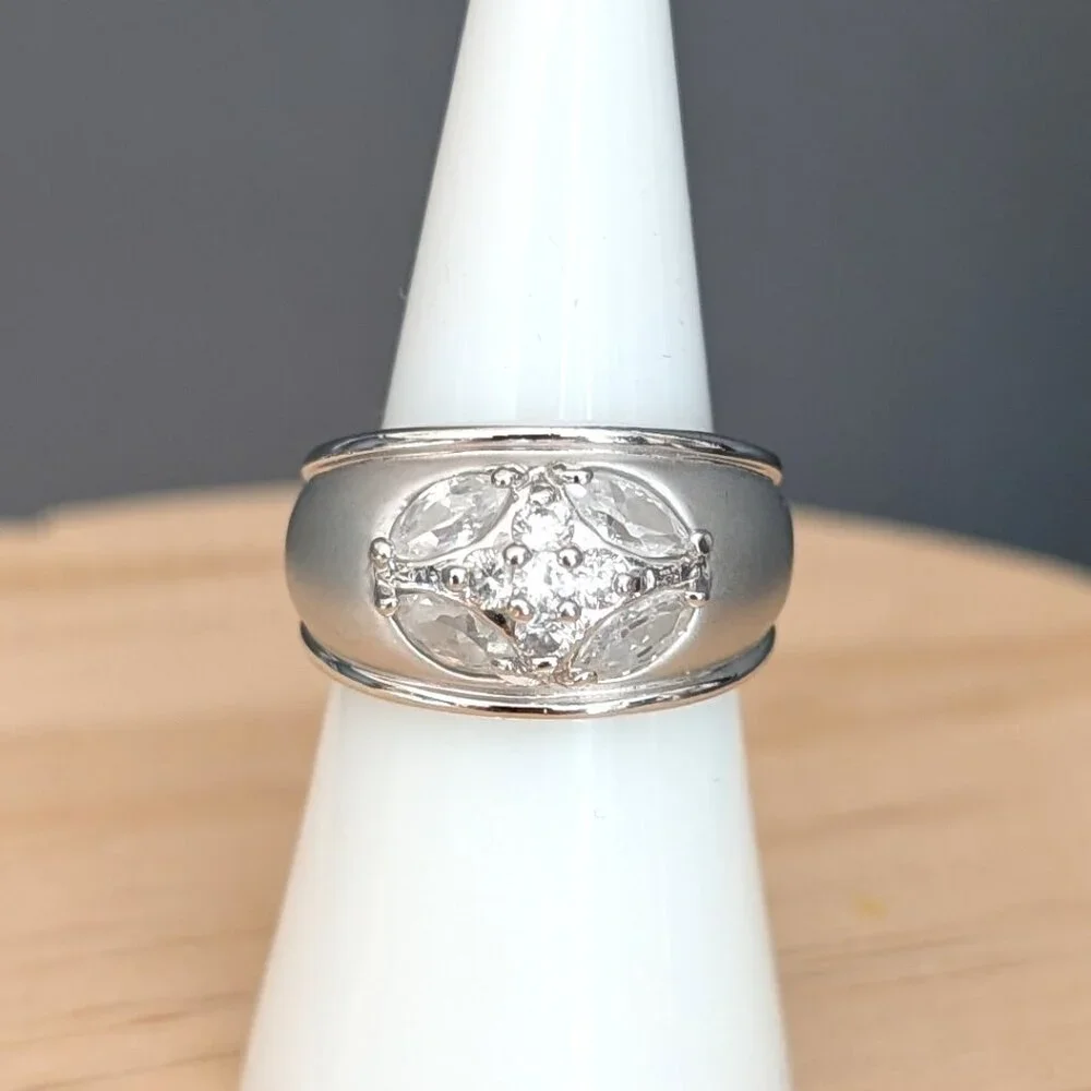Matte brushed silver tone and faux diamond wide band ring